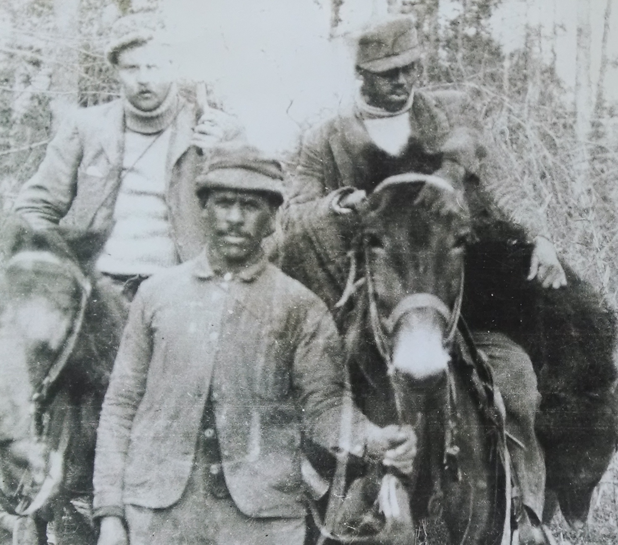 Paul Rainey and hunted companions with black bear